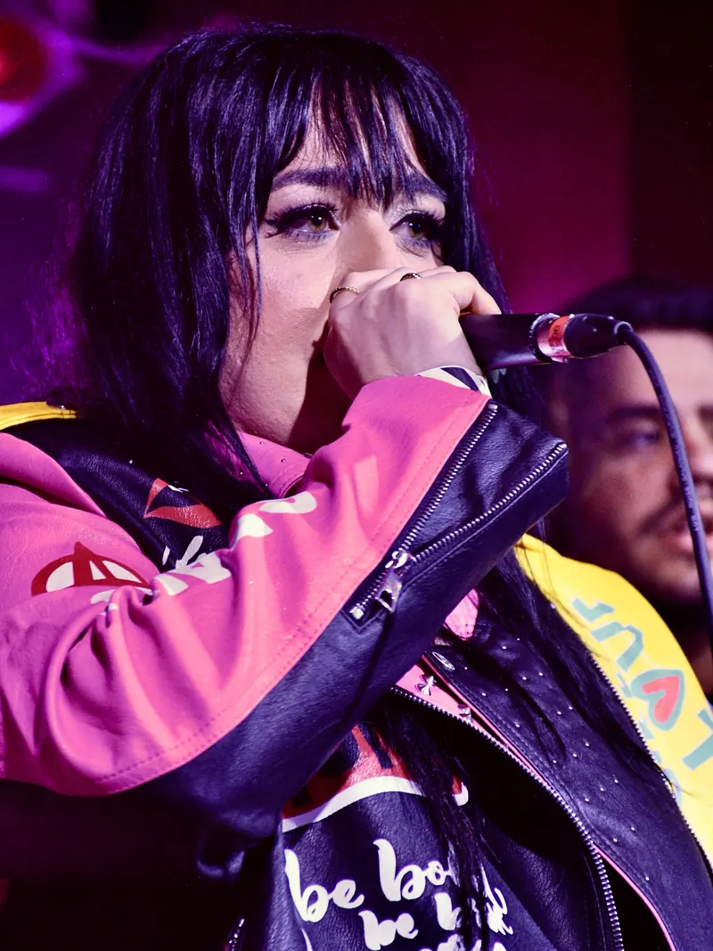 Laken of Eye Candy singing close to the microphone